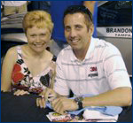 MMAJ graduate student Corri Filipowski hangs out with her favorite driver, Greg Biffle, at the Roush Museum in Livonia, Mich. in August 2007.  Biffle drives the #16 3M Ford Fusion for Roush Fenway Racing.